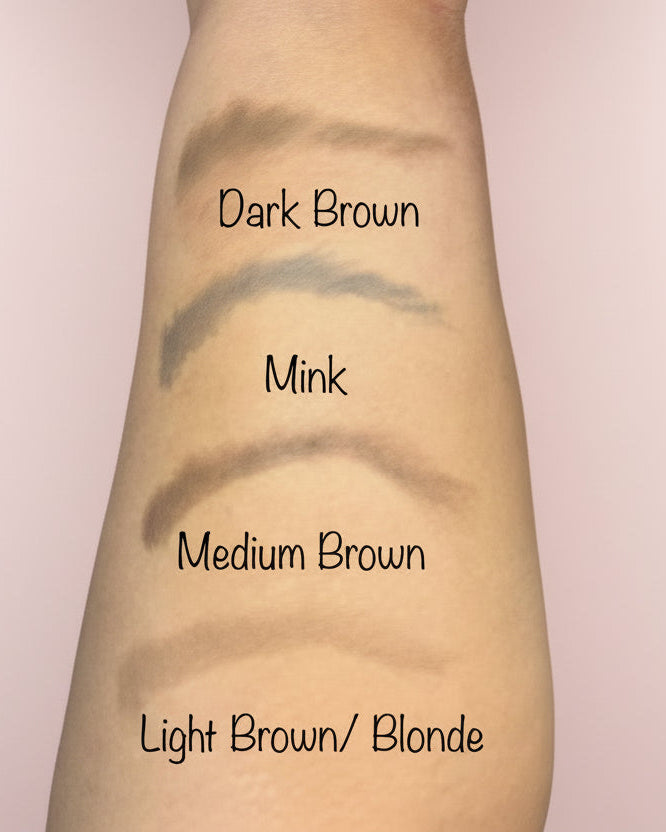 Eyebrow shades swatched on a person's arm with labels.