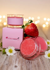 Strawberry Lip sugar scrub with strawberries and flowers on a wooden surface