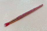 Round blending for eye makeup brush with pink bristles and a pink rhinestone handle on a sparkly background by La Paz Cosmetics