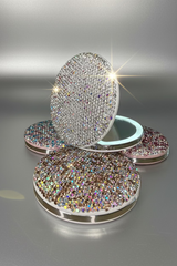 The ultimate luxury for your purse or vanity! Rechargeable LED compact mirror 1X &12X In White Crystal, Pink, Blue & White, Pink & White and Golden.