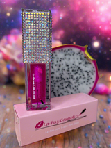 Jupiter lip oil with rhinestone top on La Paz Cosmetics box against a colorful background