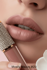 Close-up of lips wearing La Paz M20 Mostly Mauve Diamond Liquid Matte Lipstick — dusty nude mauve matte 