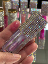 Oceans lip oil swatch on a fingertip 