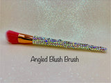 Angled Blush Brush with a full aurora crystal handle, gold ferrule and pink bristles by La Paz Cosmetics on a white background 