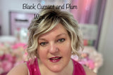 founder wearing black currant lip oil with a lip liner