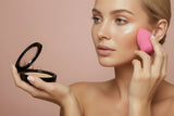 Compact of Creamy Beige foundation in a black case on a white background