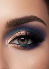 Close-up of a model's eye showcasing  dramatic Mercury Eyeshadow Palette eye makeup with a shimmery bronze-gold eyeshadow base, deep purple and blue shadow, and black eyeliner.