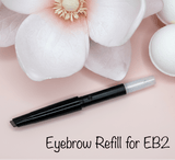 La Paz Cosmetics Luxe Crystal Eyebrow Pencil refill for EB2 Light Brown/Blonde on pink background with white magnolia flowers