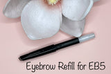 La Paz Cosmetics Luxe Crystal Eyebrow Pencil refill for EB5 Dark Brown on pink background with white magnolia flowers