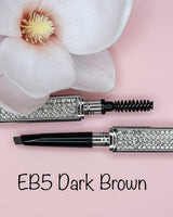 La Paz Cosmetics Luxe Crystal Eyebrow Pencil EB5 Dark Brown open showing dual-ended design with spoolie and precision tip, crystal case on pink background with white orchid