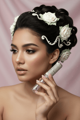 Bride-inspired model with rose updo holding La Paz Crystal Frosting Lip Gloss Frosted Glaze D09 with glass shimmer lips