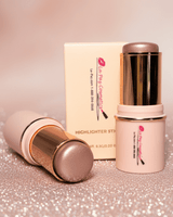 La Paz Cosmetics Adorned Glow 05 Shimmer Highlighter Stick —sticks open showing a soft mauve pink highlighter