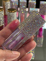 Oceans lip oil swatch on a fingertip 