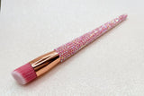 Stippling Makeup brush with pink bristles and a pink rhinestone handle on a sparkly background by La Paz Cosmetics