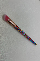Rainbow  Bling Angled Eye Makeup Brush with a full multicolored crystal handle, gold ferrule and pink bristles by La Paz Cosmetics on a white background 