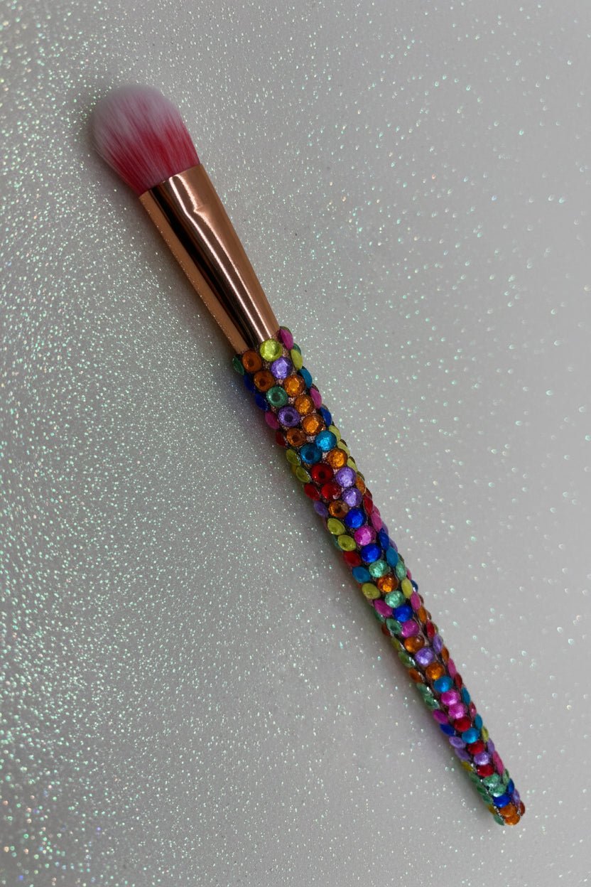 Rainbow  Bling Flat Eye Makeup Brush with a full multicolored crystal handle, gold ferrule and pink bristles by La Paz Cosmetics on a white background 