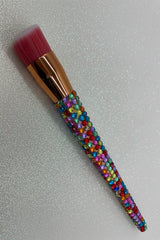 Rainbow  Bling Stippling Brush with a full multicolored crystal handle, gold ferrule and pink bristles by La Paz Cosmetics on a white background 