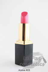 A tube of L'Paige lipstick in Azalea Pink color, with a gold and black packaging.